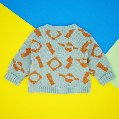 Back of mint and orange wool jacquard baby jumper.