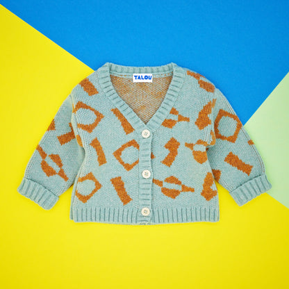 Mint and orange wool children's cardigan. Bold, fun, jacquard design.